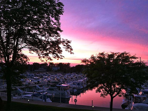 the moorings at sunset overlooking boats with purple sky