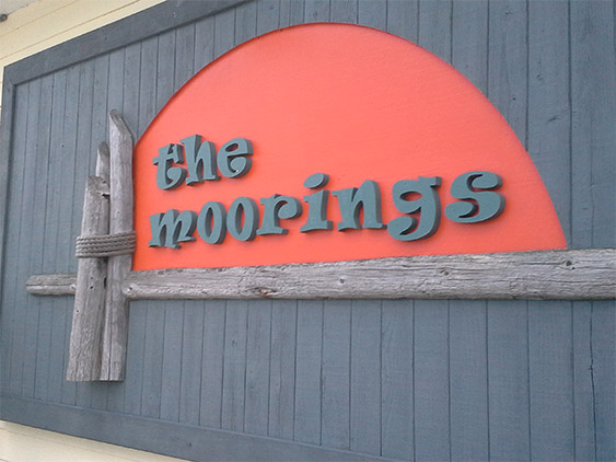 The Moorings Association wall sign